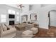 Spacious living room features a fireplace, hardwood floors, and large windows at 3009 Scottcrest Way, Waxhaw, NC 28173