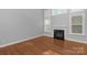 Bright living room with fireplace, hardwood floors, and large windows at 3009 Scottcrest Way, Waxhaw, NC 28173