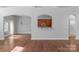 Spacious living room with hardwood floors and an open view to the kitchen at 3009 Scottcrest Way, Waxhaw, NC 28173