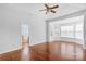 Main bedroom boasts tray ceiling, ceiling fan, hardwood floor and bay window at 3009 Scottcrest Way, Waxhaw, NC 28173