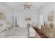 A digitally staged main bedroom with tray ceiling and neutral furniture at 3009 Scottcrest Way, Waxhaw, NC 28173