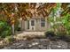 Charming patio with stone pavers, wooden pergola, and access to the home's interior at 3009 Scottcrest Way, Waxhaw, NC 28173