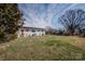 Expansive backyard featuring a well-maintained lawn and mature trees at 3029 Wendover Nw Rd, Concord, NC 28027