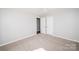 Neutral bedroom featuring plush carpet and ample natural light at 3029 Wendover Nw Rd, Concord, NC 28027