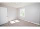 Bright bedroom featuring neutral walls and a ceiling fan at 3029 Wendover Nw Rd, Concord, NC 28027