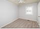 Cozy bedroom with a ceiling fan and natural light from a window at 3029 Wendover Nw Rd, Concord, NC 28027