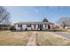 Charming single-story home with well-maintained lawn and inviting curb appeal at 3029 Wendover Nw Rd, Concord, NC 28027