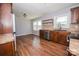 Well-lit kitchen with stainless steel appliances, wood floors, and granite countertops at 3029 Wendover Nw Rd, Concord, NC 28027