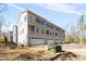 Exterior view of new townhomes featuring private garages and balconies with neutral siding at 3816 Odom Way, Charlotte, NC 28216