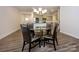 Open-concept dining room seamlessly connects to a modern kitchen, ideal for Gathering gatherings at 4242 Plumeria Way, Fort Mill, SC 29707