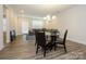 Open dining area connected to a cozy living room, perfect for entertaining guests at 4242 Plumeria Way, Fort Mill, SC 29707