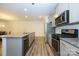 Well-equipped kitchen with a large island, stainless steel appliances, and plenty of cabinet space at 4242 Plumeria Way, Fort Mill, SC 29707