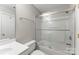 An all-white bathroom featuring a shower/tub and toilet with tile surround at 6464 Park Pond Dr # 7, Charlotte, NC 28262