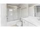 Bright bathroom with a glass shower door and white vanity with drawers and storage at 6464 Park Pond Dr # 7, Charlotte, NC 28262