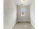 A simple bedroom with a window provides ample natural light and a cozy atmosphere at 6464 Park Pond Dr # 7, Charlotte, NC 28262