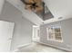 Bright bedroom featuring a ceiling fan, and a large window with a window seat at 6464 Park Pond Dr # 7, Charlotte, NC 28262