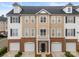 Attractive townhome with a black roof, brick, and stylish architectural details at 6464 Park Pond Dr # 7, Charlotte, NC 28262