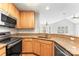 Modern kitchen with granite countertops, stainless steel appliances, and light wood cabinetry at 6464 Park Pond Dr # 7, Charlotte, NC 28262