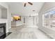 Spacious living area featuring a cozy fireplace and a breakfast bar at 6464 Park Pond Dr # 7, Charlotte, NC 28262