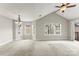 Bright, open living room with neutral carpet, vaulted ceilings, and plenty of natural light at 6464 Park Pond Dr # 7, Charlotte, NC 28262