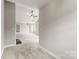 Bright living room with fireplace and view of the kitchen at 6464 Park Pond Dr # 7, Charlotte, NC 28262