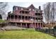 Backyard view of large two story home with multi-level decks and green grass at 649 46Th Avenue Ne Dr, Hickory, NC 28601
