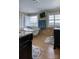 Bright bathroom featuring a freestanding tub, double vanities, and shuttered windows at 649 46Th Avenue Ne Dr, Hickory, NC 28601