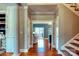 Inviting hallway with hardwood floors leading to a bright living area and staircase at 649 46Th Avenue Ne Dr, Hickory, NC 28601