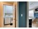 Hallway view of the laundry room and a bright bathroom with a freestanding tub at 649 46Th Avenue Ne Dr, Hickory, NC 28601