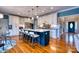 Modern kitchen with a large island, seating, stainless steel appliances, and stylish pendant lighting at 649 46Th Avenue Ne Dr, Hickory, NC 28601