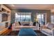 Comfortable living room showcasing a plush sofa, ottoman, and window views to the outdoor space at 649 46Th Avenue Ne Dr, Hickory, NC 28601