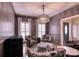 Elegant living room with patterned chairs, large windows, and stylish lighting at 649 46Th Avenue Ne Dr, Hickory, NC 28601