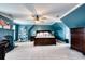 Serene main bedroom showcasing a dark wood bed set and a cozy fireplace at 649 46Th Avenue Ne Dr, Hickory, NC 28601