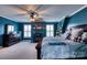 Comfortable main bedroom with a fireplace, a ceiling fan, and lots of natural light at 649 46Th Avenue Ne Dr, Hickory, NC 28601