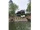 Exterior view from the lake of a brick two story home with multi-level decks at 649 46Th Avenue Ne Dr, Hickory, NC 28601