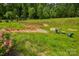 Sloping backyard featuring a firepit area and stairs to the home at 6858 Hunts Mesa Dr, Fort Mill, SC 29707