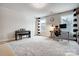 Bright bonus room with desk, piano, and ample space for various activities at 6858 Hunts Mesa Dr, Fort Mill, SC 29707