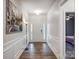 Bright foyer featuring hardwood floors, classic wainscotting and a view to the front door at 6858 Hunts Mesa Dr, Fort Mill, SC 29707