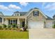 Charming home with stone accents, inviting curb appeal, and a two car garage at 6858 Hunts Mesa Dr, Fort Mill, SC 29707