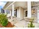 Inviting front porch with stone accents and classic architectural details at 6858 Hunts Mesa Dr, Fort Mill, SC 29707