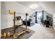 Spacious home gym under angled ceilings, complete with weight equipment and comfortable seating at 6858 Hunts Mesa Dr, Fort Mill, SC 29707