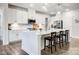 Well-lit kitchen featuring a large island with bar seating and stainless steel appliances at 6858 Hunts Mesa Dr, Fort Mill, SC 29707