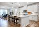 Bright kitchen with a large central island, stainless steel appliances, and an adjacent dining area at 6858 Hunts Mesa Dr, Fort Mill, SC 29707