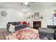 Cozy living room with fireplace, ceiling fan, large rug and plenty of natural light at 6858 Hunts Mesa Dr, Fort Mill, SC 29707
