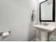 Bathroom features pedestal sink and a decorative mirror at 6858 Hunts Mesa Dr, Fort Mill, SC 29707