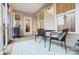 Relaxing screened porch featuring a grill, table and chairs for outdoor entertaining at 6858 Hunts Mesa Dr, Fort Mill, SC 29707