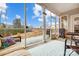 Enjoy the views from the cozy screened-in porch with comfortable seating and serene landscaping at 6858 Hunts Mesa Dr, Fort Mill, SC 29707