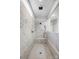 Modern walk-in shower with sleek marble tiling, a built-in bench, and contemporary fixtures for a spa-like experience at 6858 Hunts Mesa Dr, Fort Mill, SC 29707