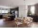 Bright, spacious kitchen and dining area featuring modern finishes and plenty of seating at 7003 Impulse Ct, Charlotte, NC 28205