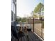 Cozy outdoor patio with a round table, seating, and black metal railing, perfect for enjoying the outdoors at 7003 Impulse Ct, Charlotte, NC 28205